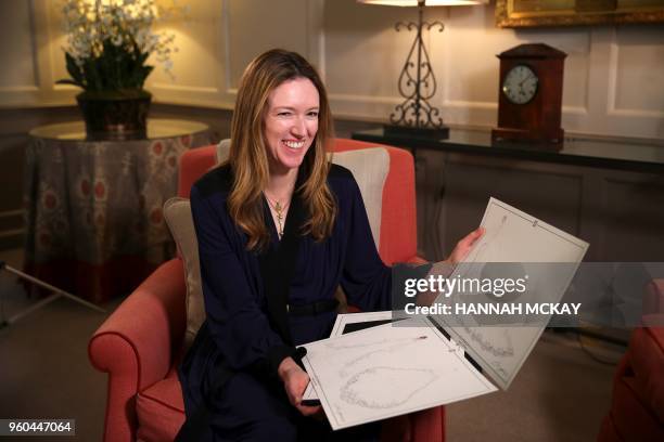 Clare Waight Keller, a fashion designer at Givenchy, holds dress sketches during an interview at Kensington Palace in London on May 20 the day after...