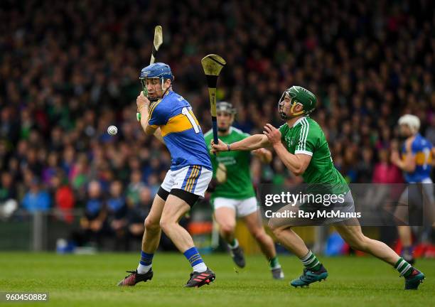 Limerick , Ireland - 20 May 2018; Sean Finn of Limerick dives in to block a shot by John McGrath of Tipperary during the Munster GAA Hurling Senior...