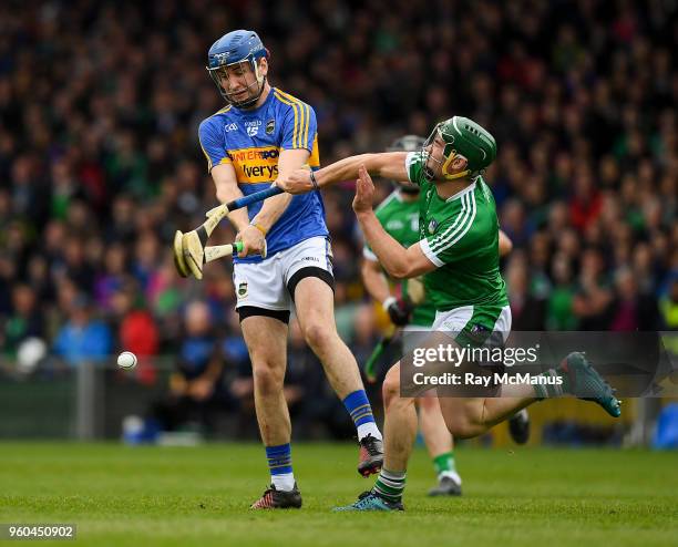 Limerick , Ireland - 20 May 2018; Sean Finn of Limerick dives in to block a shot by John McGrath of Tipperary during the Munster GAA Hurling Senior...