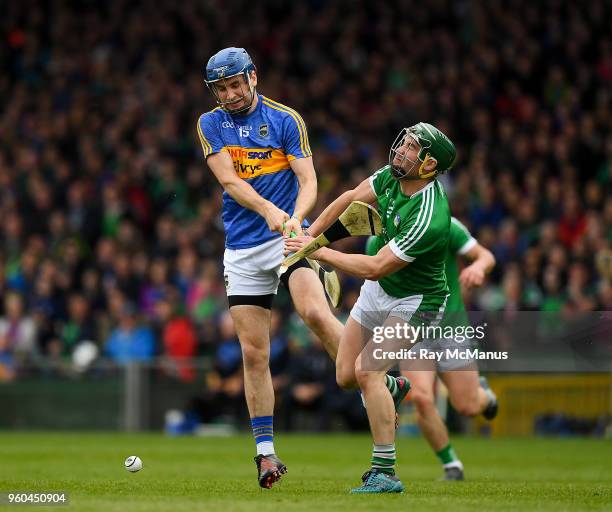 Limerick , Ireland - 20 May 2018; Sean Finn of Limerick dives in to block a shot by John McGrath of Tipperary during the Munster GAA Hurling Senior...