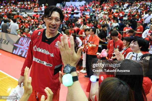 Shunsuke Ito of the Chiba Jets high fives with fans after the B.League Championship semi final game 2 between Chiba Jets and Ryukyu Golden Kings at...