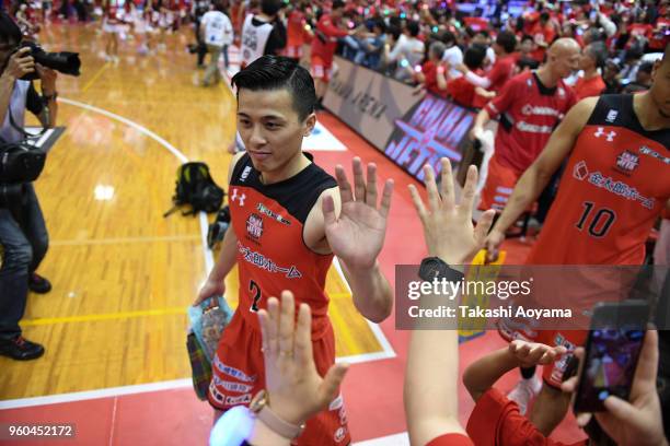 Yuki Togashi of the Chiba Jets high fives with fans after the B.League Championship semi final game 2 between Chiba Jets and Ryukyu Golden Kings at...