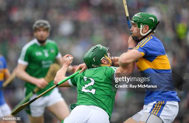 Limerick , Ireland - 20 May 2018; Sean Finn of Limerick is tackled by Noel McGrath of Tipperary during the Munster GAA Hurling Senior Championship...