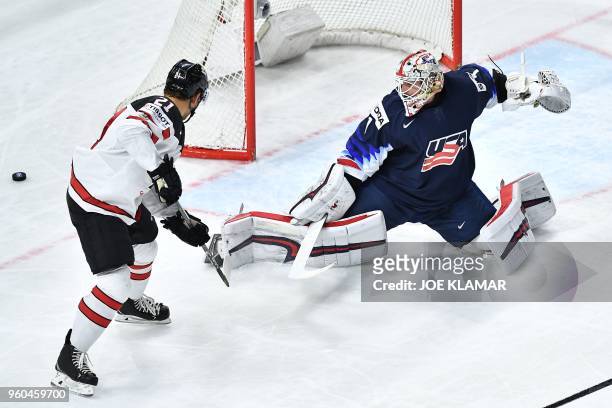 Canada's Tyson Jost vies with United States' goaltender Keith Kinkaid during the bronze medal match USA vs Canada of the 2018 IIHF Ice Hockey World...