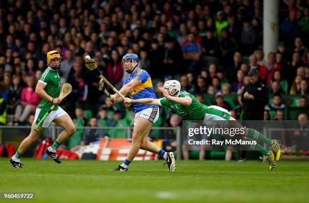 Limerick , Ireland - 20 May 2018; Seamus Hickey of Limerick dives in to block this shot by Jason Forde of Tipperary during the Munster GAA Hurling...