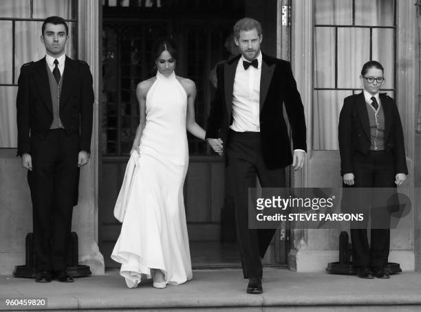 The newly married Britain's Prince Harry, Duke of Sussex, and Meghan Markle, Duchess of Sussex, leave Windsor Castle in Windsor on May 19, 2018 after...