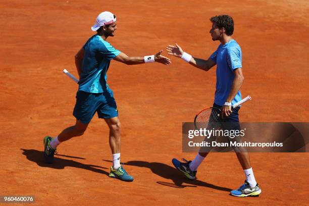 Pablo Carreno Busta of Spain and Joao Sousa of Portugal celebrate a point in their Mens doubles final match against Juan Sebastian Cabal and Robert...