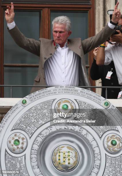 Team coach Jupp Heynckes of FC Bayern Muenchen celebrates winning the German Championship title with his team for the season 2017/18 on the balcony...