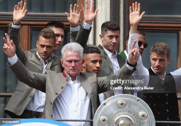 Team coach Jupp Heynckes of FC Bayern Muenchen celebrates winning the German Championship title with his team for the season 2017/18 on the balcony...