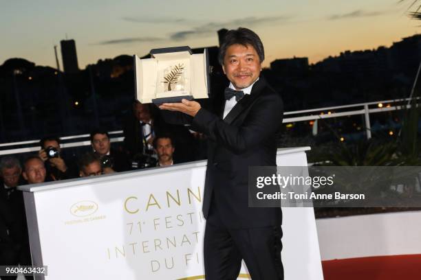 Director Hirokazu Koreeda poses with the Palme d'Or award for 'Shoplifters' at the photocall the Palme D'Or Winner during the 71st annual Cannes Film...