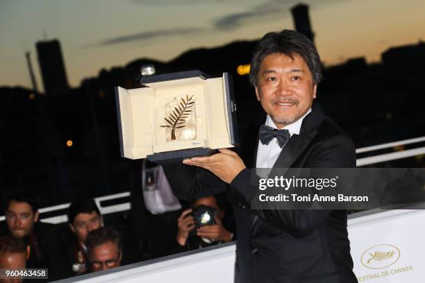 Director Hirokazu Koreeda poses with the Palme d'Or award for 'Shoplifters' at the photocall the Palme D'Or Winner during the 71st annual Cannes Film...