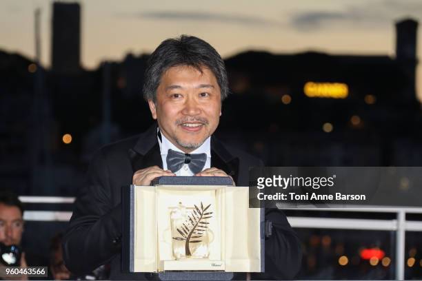Director Hirokazu Koreeda poses with the Palme d'Or award for 'Shoplifters' at the photocall the Palme D'Or Winner during the 71st annual Cannes Film...