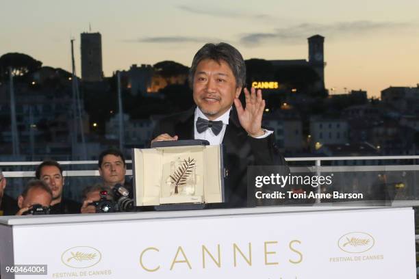 Director Hirokazu Koreeda poses with the Palme d'Or award for 'Shoplifters' at the photocall the Palme D'Or Winner during the 71st annual Cannes Film...