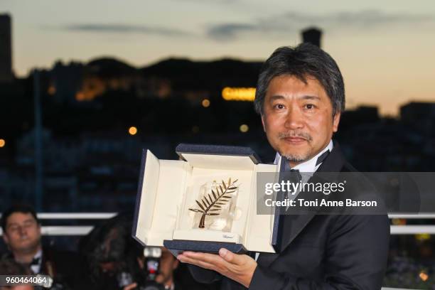 Director Hirokazu Koreeda poses with the Palme d'Or award for 'Shoplifters' at the photocall the Palme D'Or Winner during the 71st annual Cannes Film...