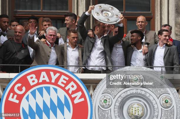 Goalkeeper Manuel Neuer of FC Bayern Muenchen lifts the Bundesliga trophy celebrating the German Championship title with his team for the season...