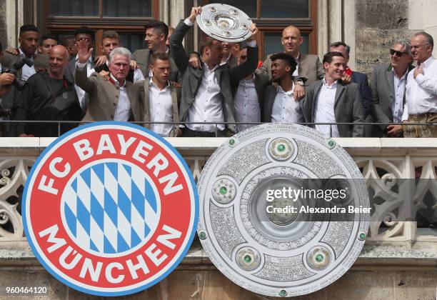 Goalkeeper Manuel Neuer of FC Bayern Muenchen lifts the Bundesliga trophy celebrating the German Championship title with his team for the season...