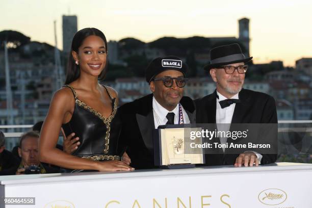 Barry Alexander Brown and Laura Harrier pose with director Spike Lee holding the Grand Prix award for 'BlacKkKlansman' and Laura Harrier next to him...