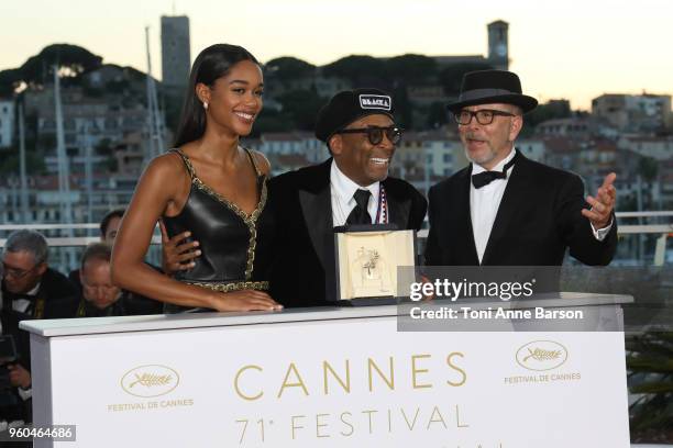 Barry Alexander Brown and Laura Harrier pose with director Spike Lee holding the Grand Prix award for 'BlacKkKlansman' and Laura Harrier next to him...