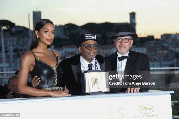 Barry Alexander Brown and Laura Harrier pose with director Spike Lee holding the Grand Prix award for 'BlacKkKlansman' and Laura Harrier next to him...