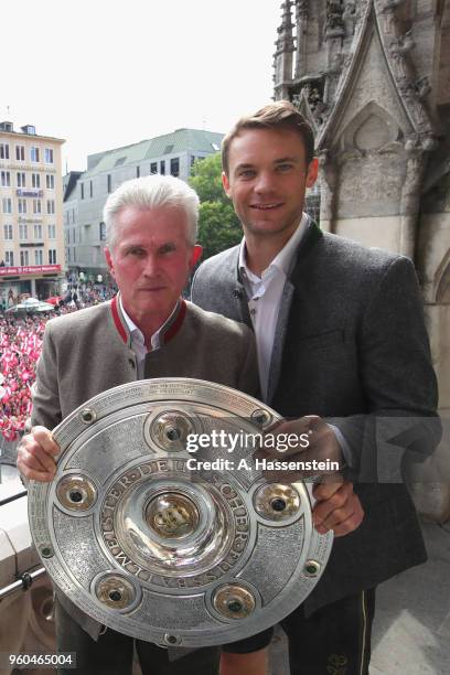 Jupp Heynckes, head coach of Bayern Muenchen celebrates winning the German Championship title with his keeper Manuel Neuer on the town hall balcony...