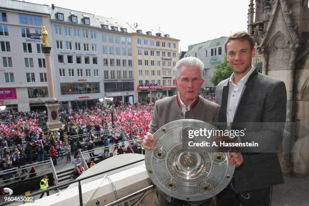 Jupp Heynckes, head coach of Bayern Muenchen celebrates winning the German Championship title with his keeper Manuel Neuer on the town hall balcony...