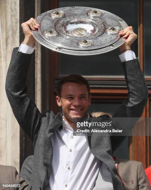 Goalkeeper Manuel Neuer of FC Bayern Muenchen lifts the Bundesliga trophy celebrating the German Championship title for the season 2017/18 on the...