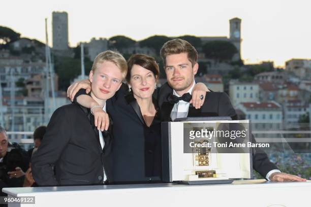Un Certain Regard Best Performance winner Victor Polster for his role in 'Girl' poses with the Director Lukas Dhont and Camera d'Or jury head Ursula...