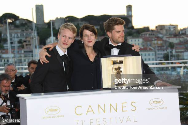 Un Certain Regard Best Performance winner Victor Polster for his role in 'Girl' poses with the Director Lukas Dhont and Camera d'Or jury head Ursula...