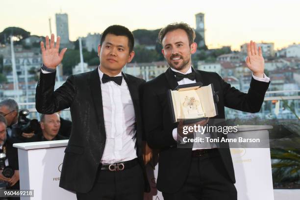 Australian director Charles Williams , short film Palme d'Or award winner for his film 'All These Creatures' poses with Wei Shujun special mention...