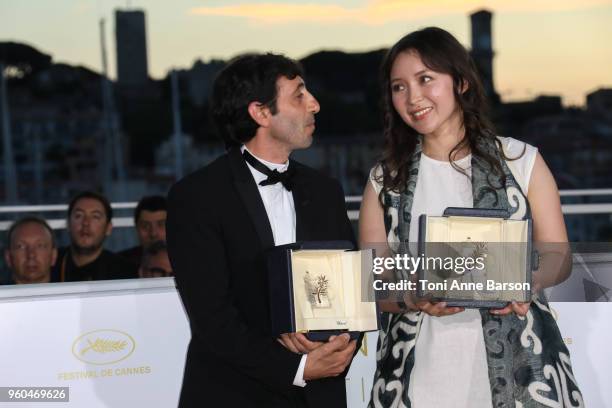 Actress Samal Yeslyamova poses with the Best Actress award for her role in 'Ayka' and actor Marcello Fonte poses with the Best Actor award for his...