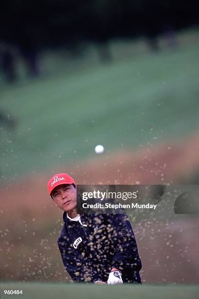 Lian-wei Zhang of China chips out of a bunker during the Omega European Masters held at the Crans-Sur-Sierre Golf Club, Switzerland. \ Mandatory...