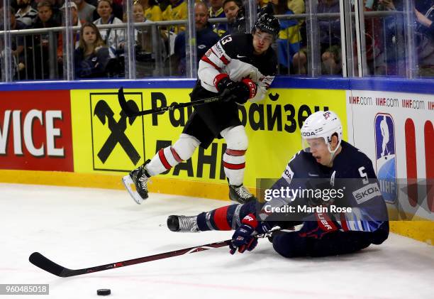 Connor Murphy of the United States and Matt Barzal of Canada battle for the puck during the 2018 IIHF Ice Hockey World Championship Bronze Medal Game...