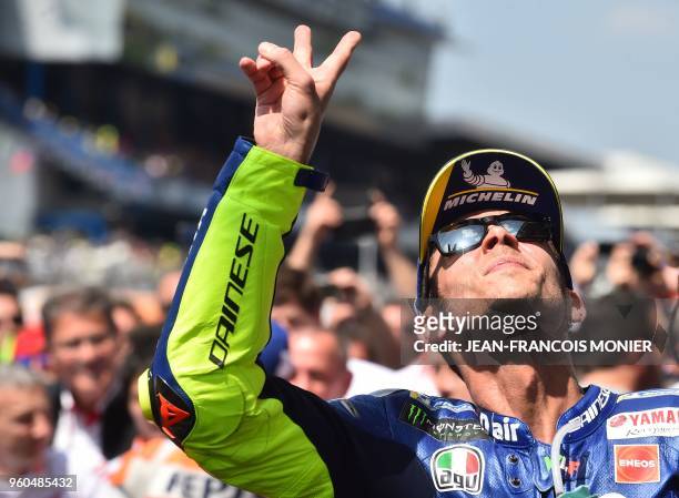 Third placed Movistar Yamaha MotoGP's Italian rider Valentino Rossi celebrates after the MotoGP race of the French motorcycling Grand Prix on May 20...