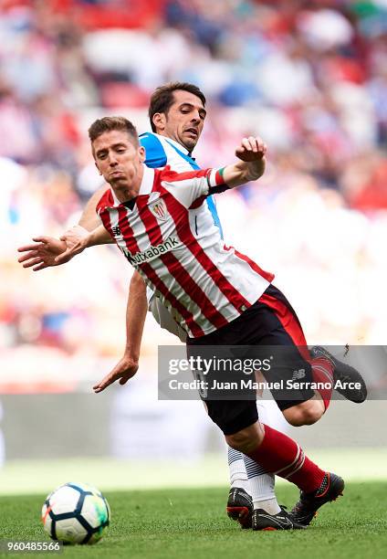Iker Muniain of Athletic Club competes for the ball with Victor Sanchez of RCD Espanyol during the La Liga match between Athletic Club and RCD...