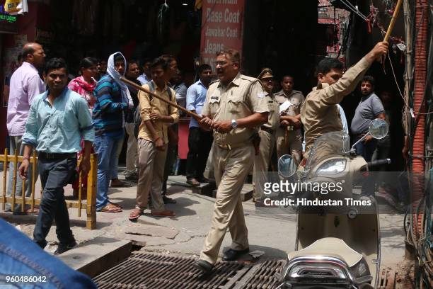 Police remove encroachments from Noida's Atta Market in Sector 18, on May 20, 2018 in Noida, India. The Noida authority said it has started its drive...