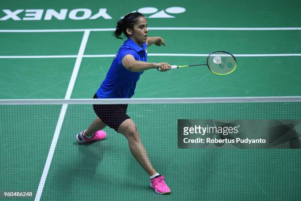 Saina Nehwal of India competes against Michelle Li of Canada during qualification match on day one of the BWF Thomas & Uber Cup at Impact Arena on...