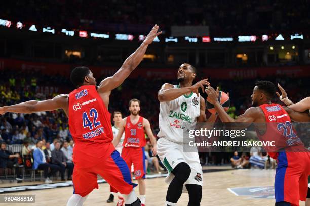 Zalgiris' US center Brandon Davies fights for the ball against CSKA's US center Kyle Hines and CSKA's US guard Cory Higgins during the Euroleague...