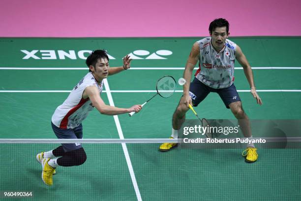 Takeshi Kamura and Keigo Sonoda of Japan compete against Lee Chun Hei Reginald and Or Chin Chung of Hong Kong during qualification match on day one...