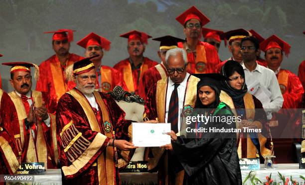 Prime Minister Narendra Modi presents a certificate to a student during the sixth convocation ceremony of the Sher-e-Kashmir University of...