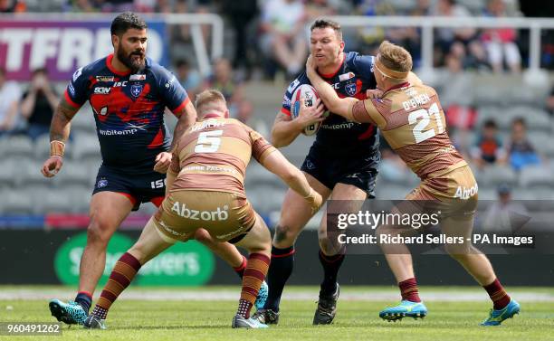 Wakefield Trinity's Keegan Hirst is tackled by Huddersfield Giants Aaron Murphy and Huddersfield giants Adam O Brien during the Betfred Super League,...