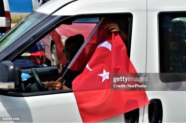 Driver waves a Turkish flag from his car during a rally in support of Meral Aksener, presidential candidate and the leader of the opposition IYI...