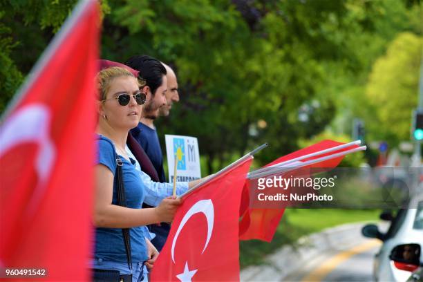 Supporter holds a Turkish flag during a rally in support of Meral Aksener, presidential candidate and the leader of the opposition IYI Party, in...