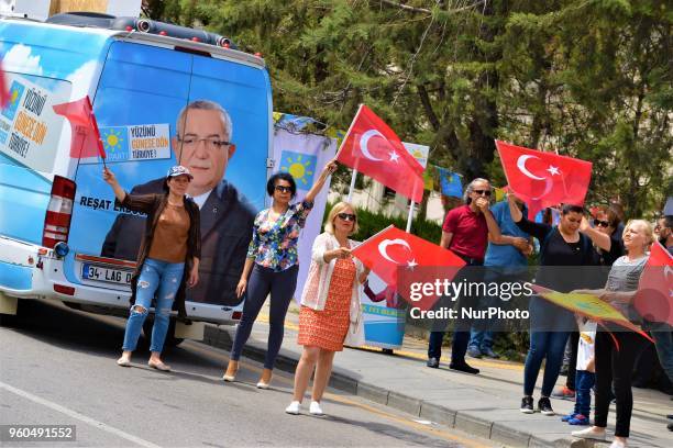 Members and supporters wave Turkish flags during a rally in support of Meral Aksener, presidential candidate and the leader of the opposition IYI...