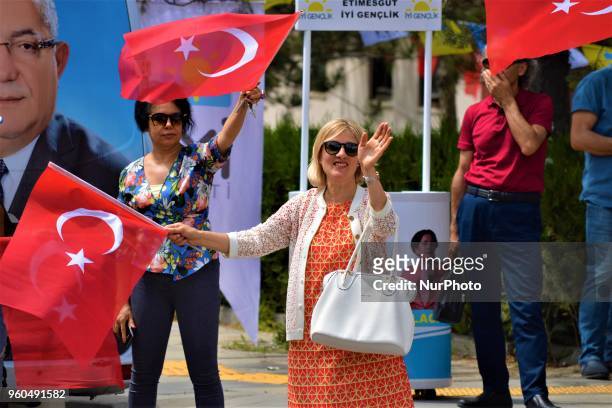 Supporter holding a Turkish flag waves her hand during a rally in support of Meral Aksener, presidential candidate and the leader of the opposition...