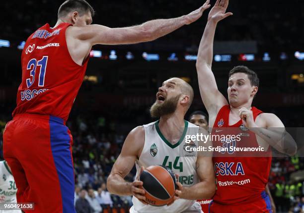 Antanas Kavaliauskas of Zalgiris in action against Victor Khryapa and Mikhail Kulagin of CSKA during the Turkish Airlines Euroleague Final Four...