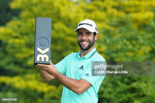 Adrian Otaegui of Spain poses with the trophy after beating Benjamin Hebert during their final match to win the tournament on the final day of the...