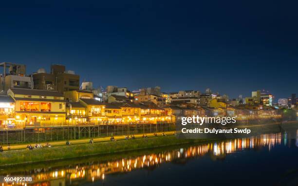 kamogawa river nearby gion at night. - kamo river stock pictures, royalty-free photos & images