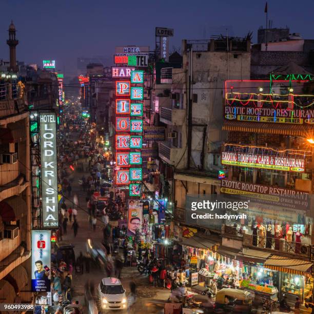 city life- main bazar by night, paharganj, new delhi, india - old delhi stock pictures, royalty-free photos & images