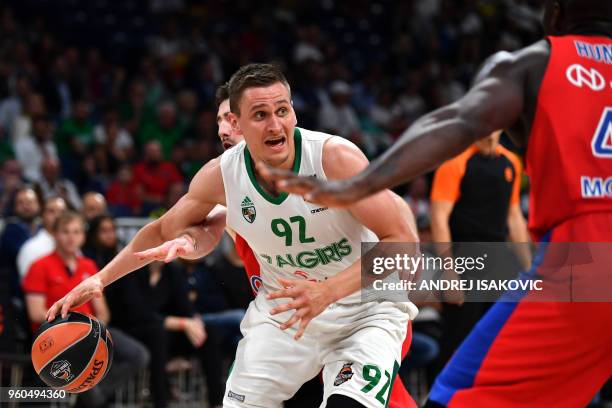 S French guard Nando De Colo fights for the ball against Zalgiris' Lithuanian forward Edgaras Ulanovas during the Euroleague Final Four third-place...