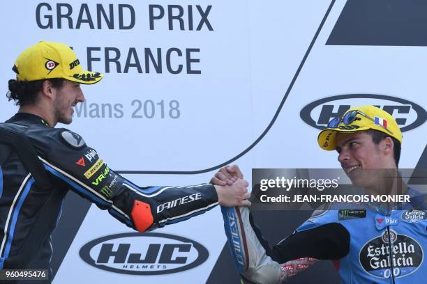 Winner Kalex Sky Racing Team VR46 Italian rider Francesco Bagnaia celebrates with third placed Kalex EG 0,0 Marc VDS Spanish rider Joan Mir on the...